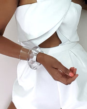 A close up of a person wearing Nik Spruill's Bubble Set in white.