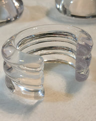A close up of a Nik Spruill WAVES CUFF on a table.