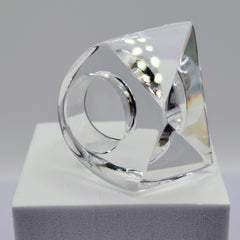 A sculpture of a YIZ ring on a white surface by Nik Spruill.