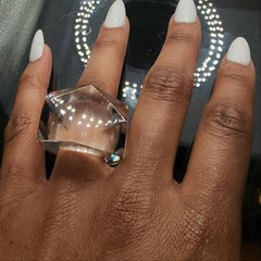 A woman's hand with an ITGA ring on it by Nik Spruill.