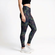 Multicolored patterned leggings worn by a person on a white background