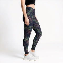 Multicolored patterned leggings worn by a person on a white background