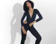 Woman wearing a black cutout jumpsuit by Nik Spruill