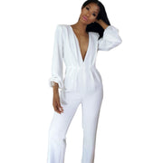 Person wearing a white outfit posing against a neutral background