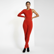 Person wearing a red jumpsuit on a white background