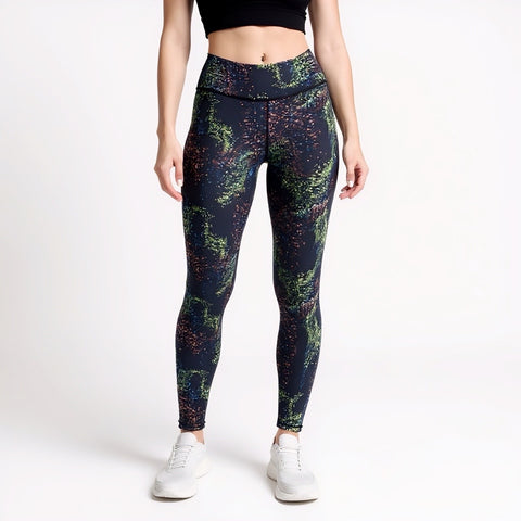 Person wearing colorful patterned leggings on a white background