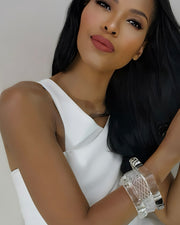 A person with long black hair wearing a white sleeveless top and distinctive Frost Lucite Bangle Bracelets by Nik Spruill poses for a photo.