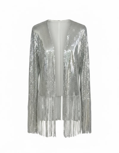 Nik Spruill SIVA STEEL SEQUIN FRINGE JACKET, its silver sparkle highlighted by long sleeves and playful fringe, set against a studio backdrop.
