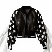 Nik Spruill Black satin jacket with interlock ribbon checkered fringe sleeves on a white background