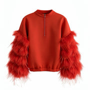 A product photo of the Nik Spruill AIR SPACE RED TOP with a mid zippered back and feathered sleeves in color red. Back view 