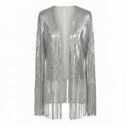 Nik Spruill SIVA STEEL SEQUIN FRINGE JACKET, its silver sparkle highlighted by long sleeves and playful fringe, set against a studio backdrop.