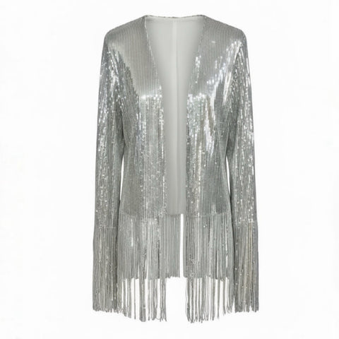 Nik Spruill SIVA STEEL SEQUIN FRINGE JACKET, its silver sparkle highlighted by long sleeves and playful fringe, set against a studio backdrop.