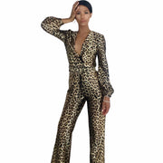 Woman wearing a leopard print jumpsuit on a white background