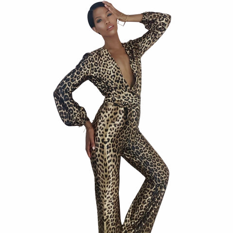 Woman wearing a leopard print jumpsuit on a white background