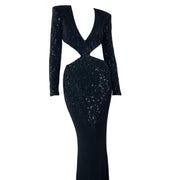 Black sequin evening gown with long sleeves on a white background
