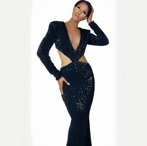 Black sequin dress with cut-out design on a white background