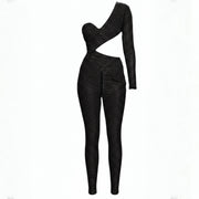 Black polka dot jumpsuit on a white background