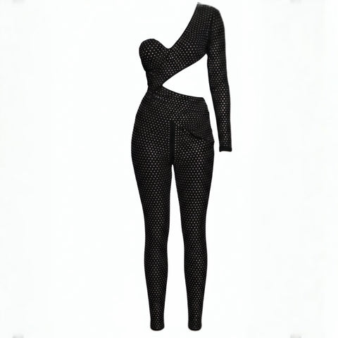 Black polka dot jumpsuit on a white background