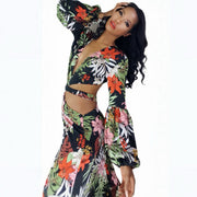 Woman wearing a colorful floral outfit on a white background