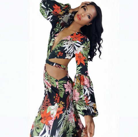 Woman wearing a colorful floral outfit on a white background