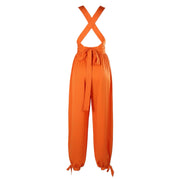 Orange jumpsuit with criss-cross straps on a white background