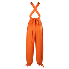 Orange jumpsuit with criss-cross straps on a white background