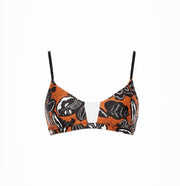 Bikini top with orange, black, and white pattern on a white background