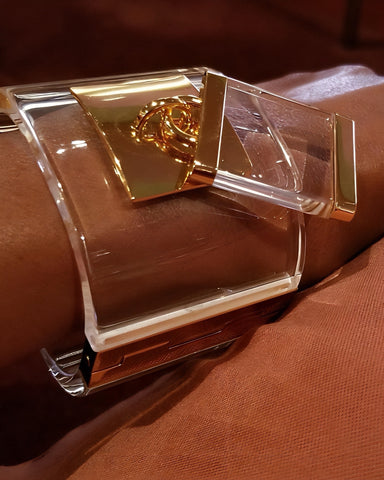NIK Spruill drop gold and clear lucite bracelet
