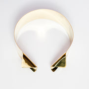 A close up of an AGOJI bracelet on a white surface by Nik Spruill.