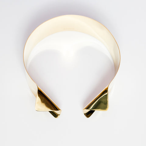 A close up of an AGOJI bracelet on a white surface by Nik Spruill.