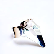 A close up of a Nanisca - Silver tie on a white surface by Nik Spruill.