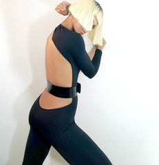 Nik Spruill brand, siide view, model Nicole Spruill blonde platinum hairstyle, bob hairstyle, One Strut Models one shoulder jumpsuit don't do it video