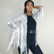 Nicole Spruill model, Front view, Silver steel heavy sequined fringe jacket, patent leather belt, one strut models don't do it vide black one shoulder jumpsuit, celebrity stylist high fashion haute couture