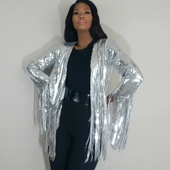 Nicole spruill, front view hands on hips, Nik Spruill brand, heavy sequined silver steel fringe jacket, one strut models don't do it video black one shoulder jumpsuit, celebrity stylist high fashion haute couture