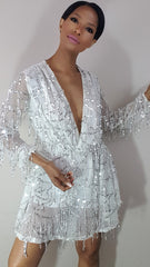 model nicole spruill in a white sheer mesh and sequin romper