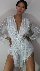 model nicole spruill in a white sheer sleeve chiffon and sequin romper hand on hip front view natural makeup