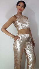 model nicole spruill, gold two piece pant suit, gold cube jewelry