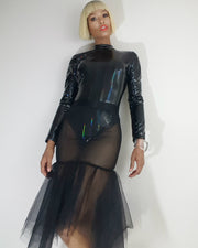 A woman in a black dress with a sheer skirt wearing the Nik Spruill NIKKI 6 TOP.
