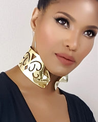 A woman wearing a Nzinga gold choker by Nik Spruill.