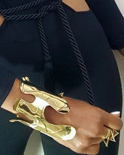 A close up of a person wearing a Nik Spruill OSHUN bracelet.