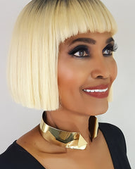 A woman with blonde hair wearing a Nik Spruill AGOJI collar.