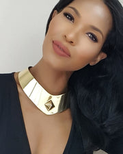 A close up of a person wearing a Nik Spruill ISIS necklace.