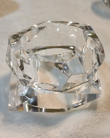 A Nik Spruill GLOSS sitting on top of a white table.