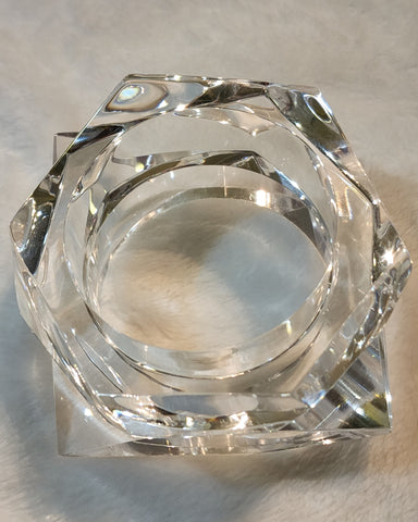 A Nik Spruill GLOSS sitting on a white surface.