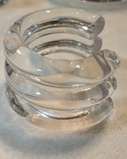 A Nik Spruill WAVES CUFF sitting on top of a table.