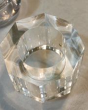 An octagonal GLACIER crystal ring on a table by Nik Spruill.