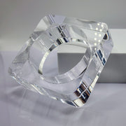 A clear glass OHSO by Nik Spruill object sitting on top of a table.