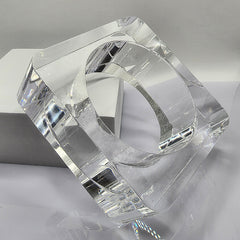 A Nik Spruill OHSO clear glass object sitting on top of a table.