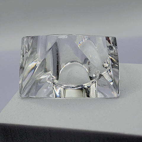 A square Nik Spruill IMAK object sitting on top of a table.