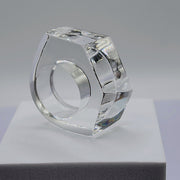 A ZENUS ring sitting on top of a Nik Spruill white box.